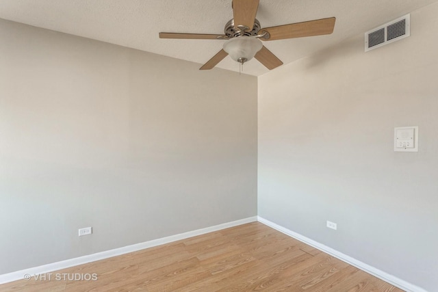 unfurnished room with ceiling fan and light wood-type flooring