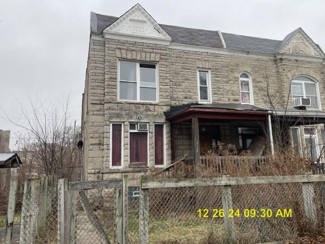 townhome / multi-family property with cooling unit and a porch