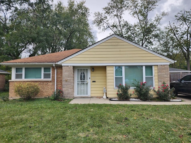 view of front of home with a front yard