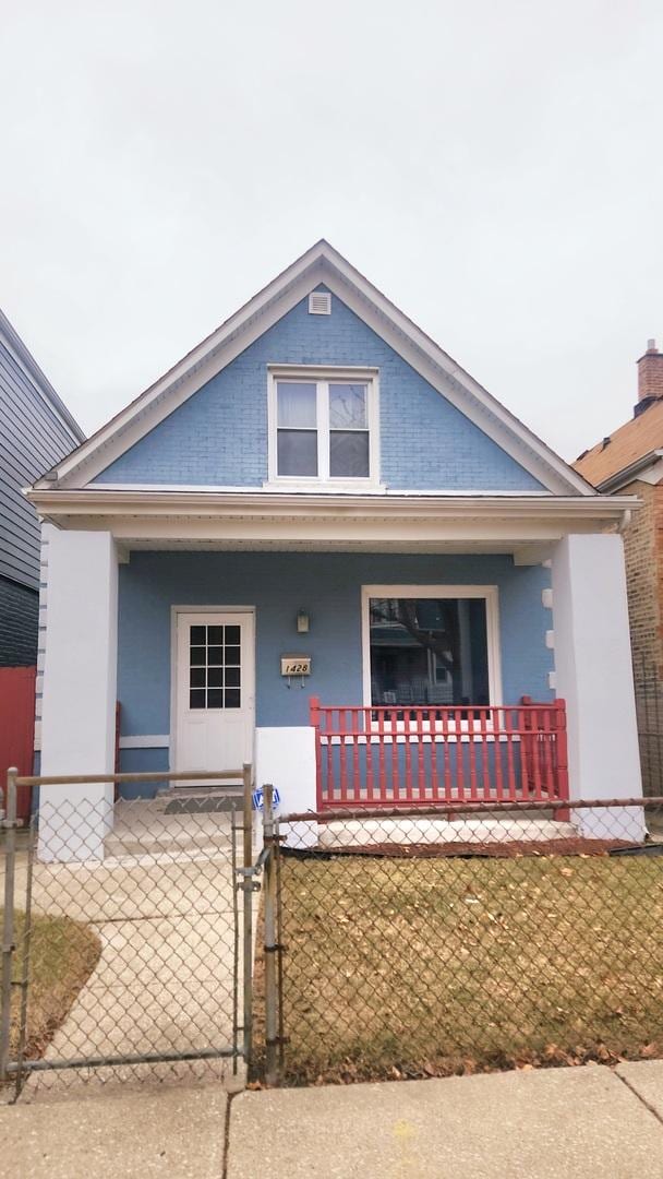 view of front facade with covered porch and a front lawn