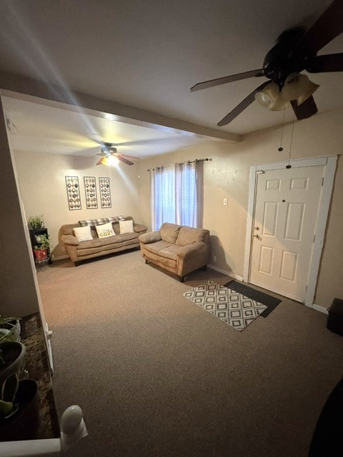 unfurnished living room featuring carpet and ceiling fan