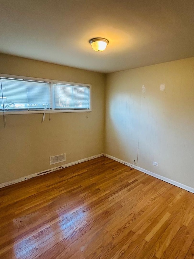 spare room with light wood-type flooring