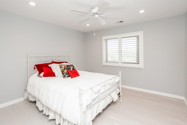 bedroom with light wood-type flooring and ceiling fan