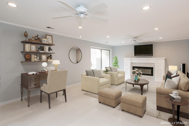 living room featuring ceiling fan and ornamental molding