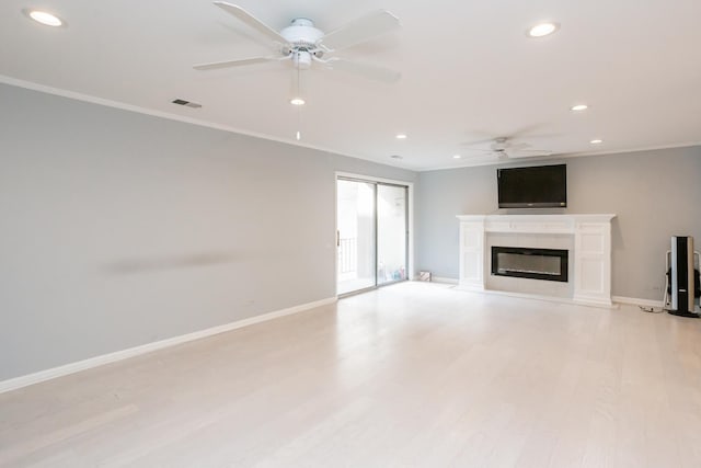 unfurnished living room with ceiling fan, crown molding, and light hardwood / wood-style floors