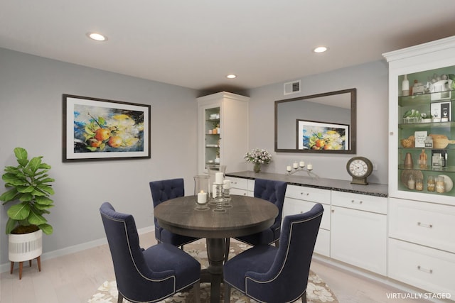 dining space featuring light hardwood / wood-style floors