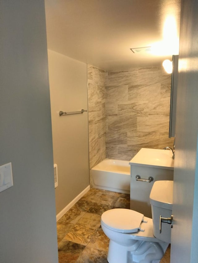 bathroom featuring toilet and vanity