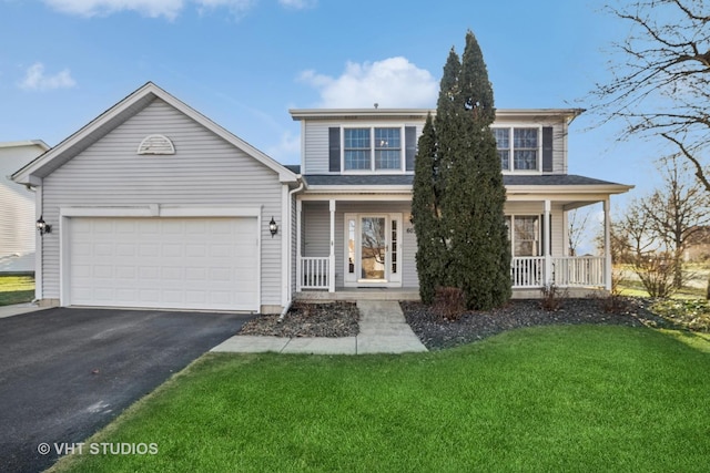 front of property with a front lawn, a garage, and a porch