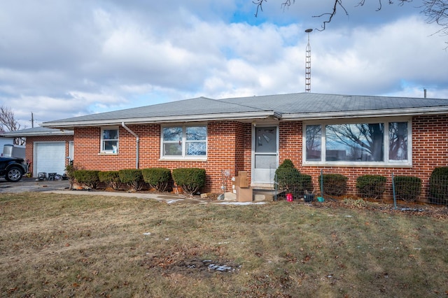 single story home with a garage and a front yard