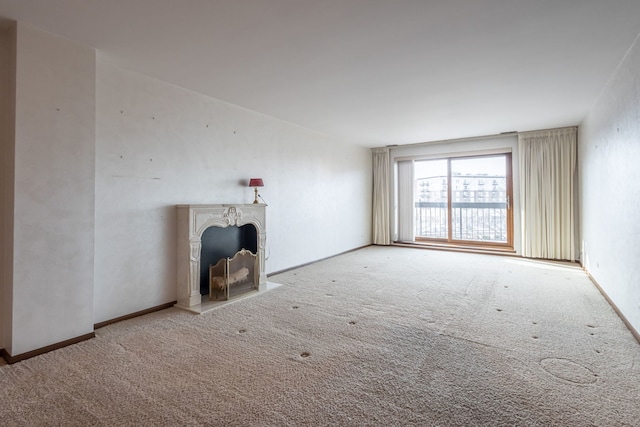 unfurnished living room with light carpet