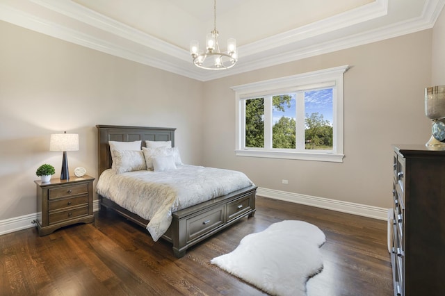 bedroom with a raised ceiling, dark hardwood / wood-style flooring, crown molding, and a chandelier