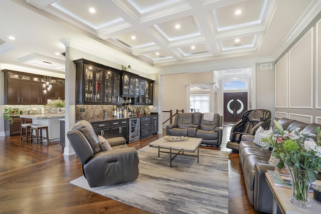 living room featuring bar, dark wood-type flooring, wine cooler, crown molding, and beam ceiling