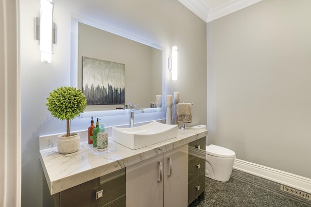 bathroom featuring toilet, ornamental molding, and vanity