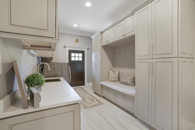 mudroom featuring light hardwood / wood-style floors and sink