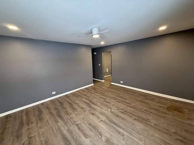 unfurnished room featuring ceiling fan and hardwood / wood-style floors