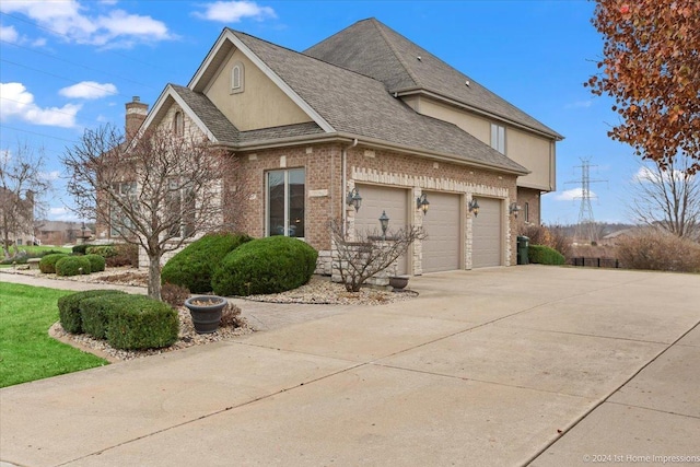 view of property exterior with a garage