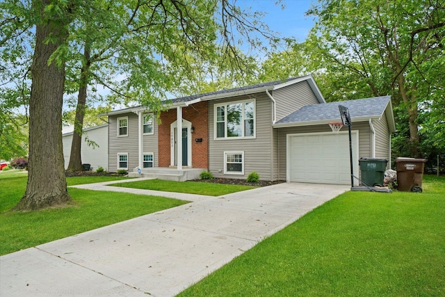 split foyer home featuring a front yard and a garage