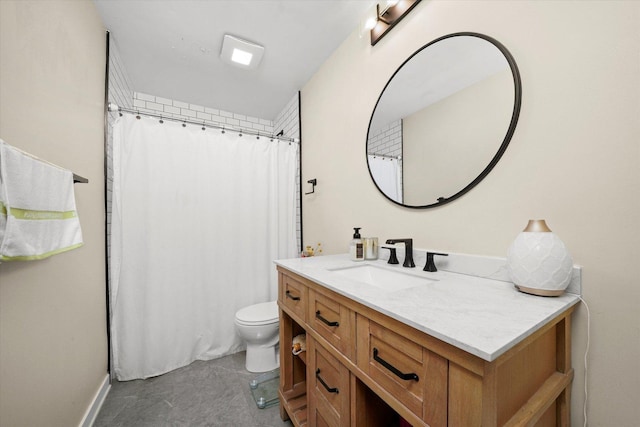 bathroom with toilet and vanity