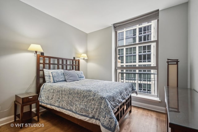 bedroom with hardwood / wood-style flooring