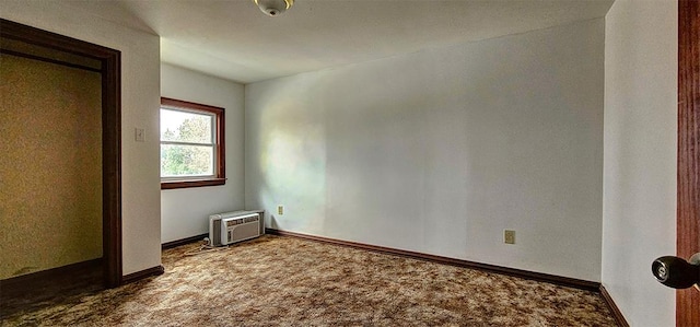 unfurnished bedroom featuring carpet and an AC wall unit