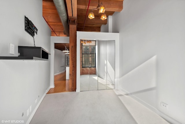 foyer entrance featuring light carpet