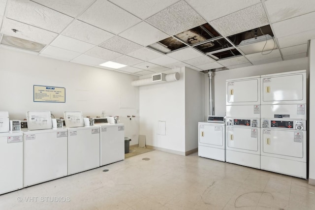 laundry area with stacked washer and clothes dryer and washer and dryer