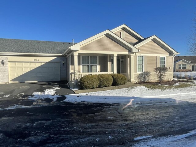 view of front of property with a front lawn and a garage