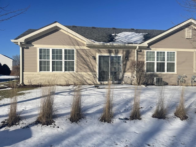 view of snow covered house