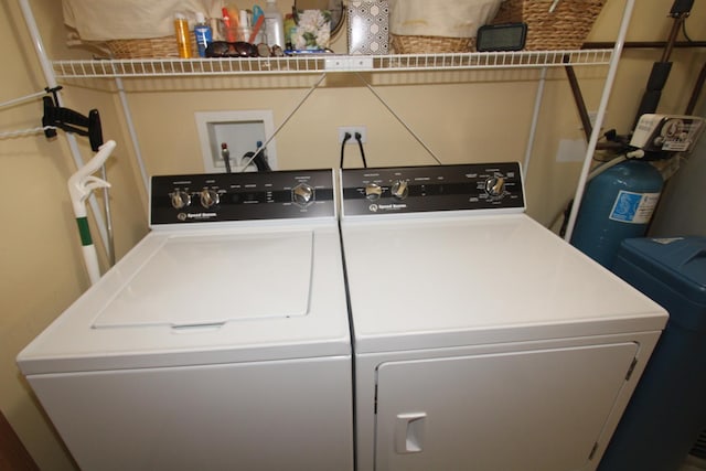 clothes washing area with independent washer and dryer