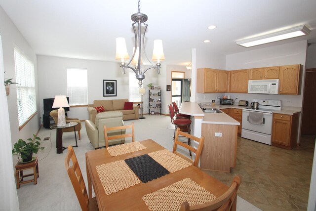 living room featuring light colored carpet and a notable chandelier