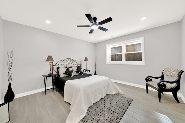 bedroom featuring ceiling fan and light hardwood / wood-style floors