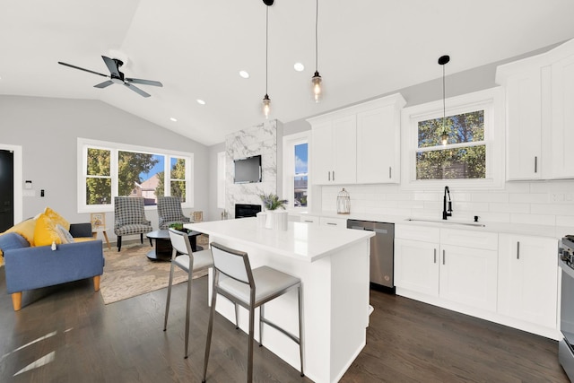 kitchen with white cabinetry, sink, backsplash, and appliances with stainless steel finishes