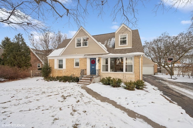 view of front of house with a garage and an outdoor structure