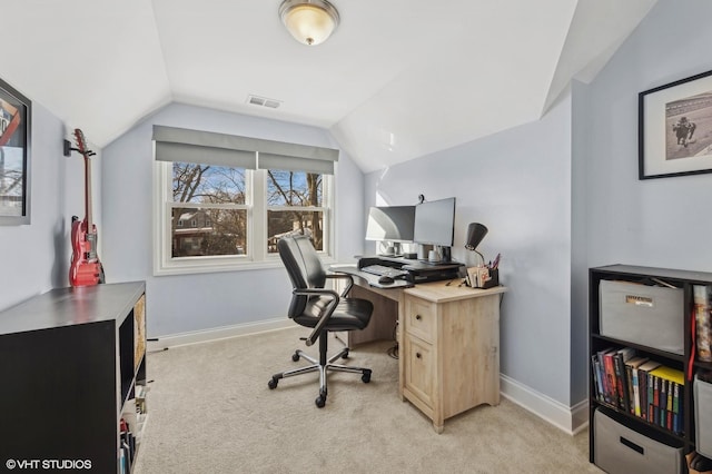 carpeted office with lofted ceiling