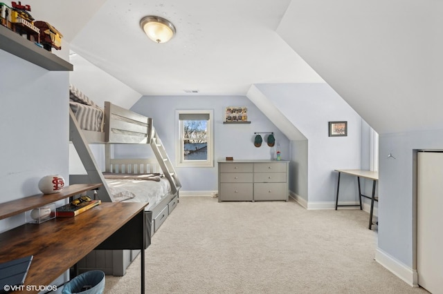 bedroom featuring vaulted ceiling and light colored carpet