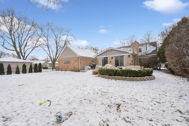 view of snow covered house