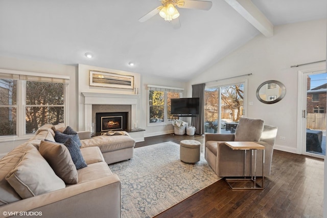 living room with dark wood-type flooring, ceiling fan, and vaulted ceiling with beams