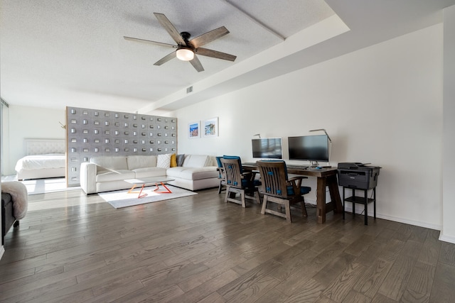 living room with ceiling fan, dark hardwood / wood-style floors, mail boxes, and a textured ceiling