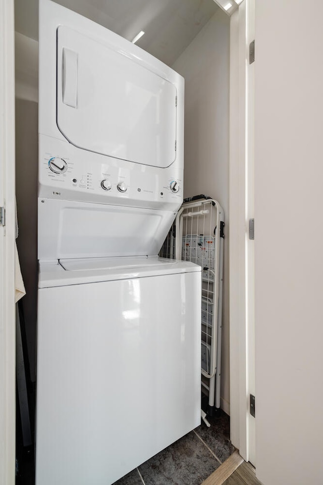 washroom with stacked washer / drying machine