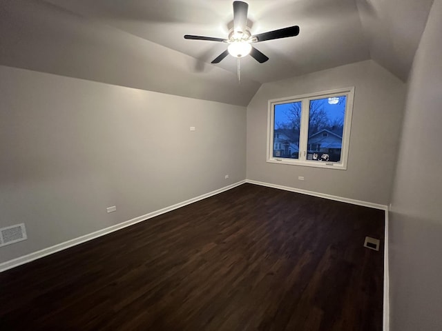 additional living space featuring lofted ceiling, dark wood-type flooring, and ceiling fan