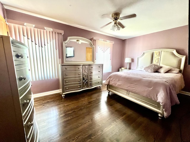 bedroom with ceiling fan and dark hardwood / wood-style flooring