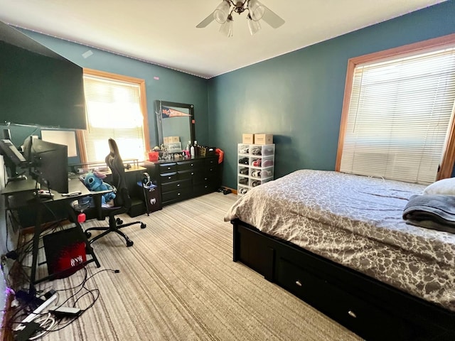 carpeted bedroom with ceiling fan