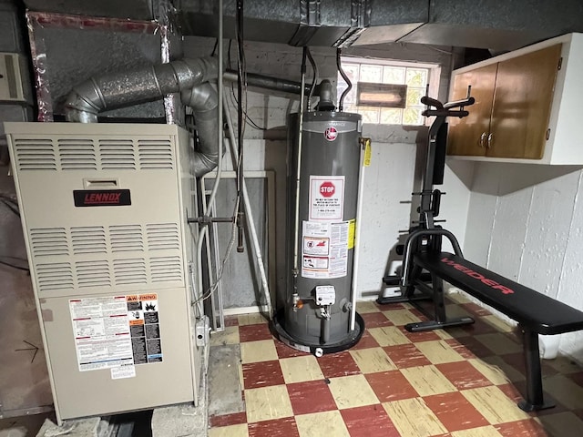 utility room with heating unit and gas water heater