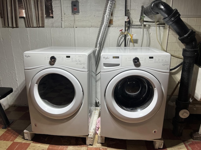 laundry room featuring separate washer and dryer