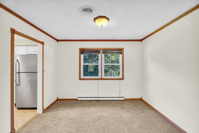 carpeted empty room with a baseboard heating unit, ornamental molding, and a textured ceiling