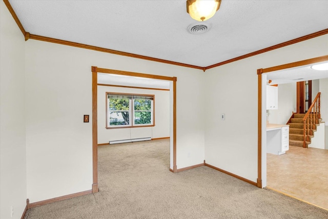 carpeted empty room with baseboard heating, a textured ceiling, and ornamental molding