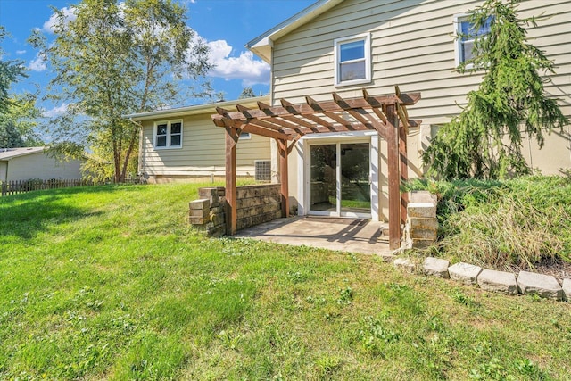 rear view of property with a patio, a lawn, and a pergola