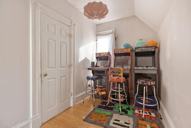 rec room with lofted ceiling and wood-type flooring