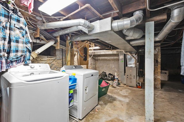 basement with separate washer and dryer and heating unit