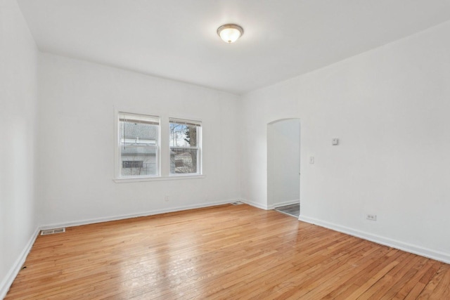 spare room featuring light hardwood / wood-style floors